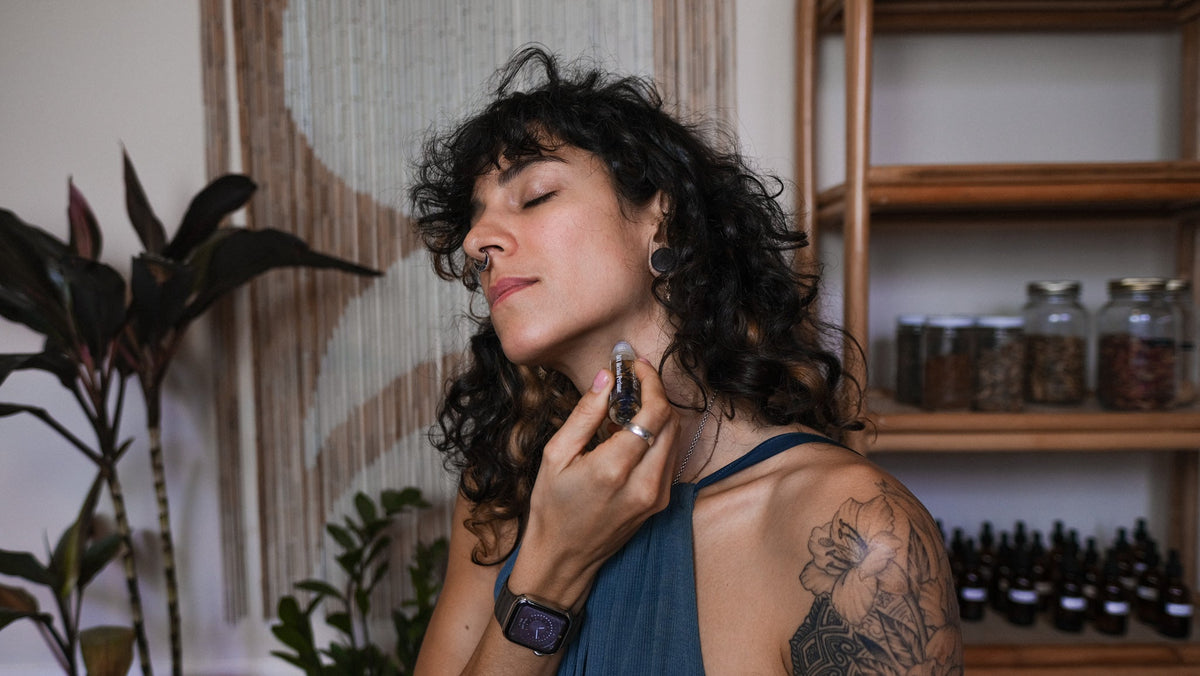 boho girl applying natural perfume